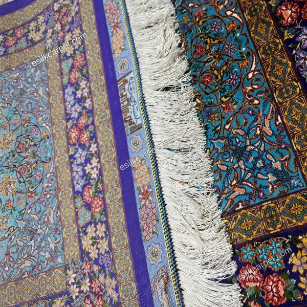 فرش دستباف ترنج فیروزه‌ای لور بنفش با ابعاد 79*115 سانتیمتر، ترکیب بی‌نظیری از رنگ‌ها و طرح‌های ایرانی. esilkcarpet.com